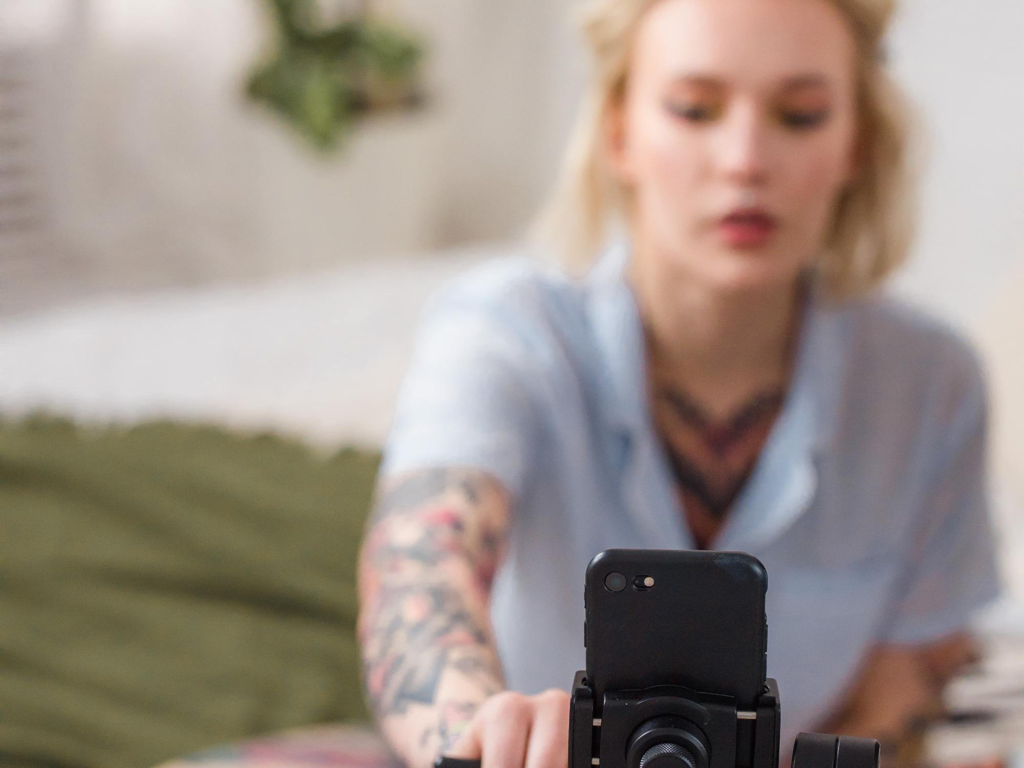 TikTok cybersecurity threat - girl poses in front of camera