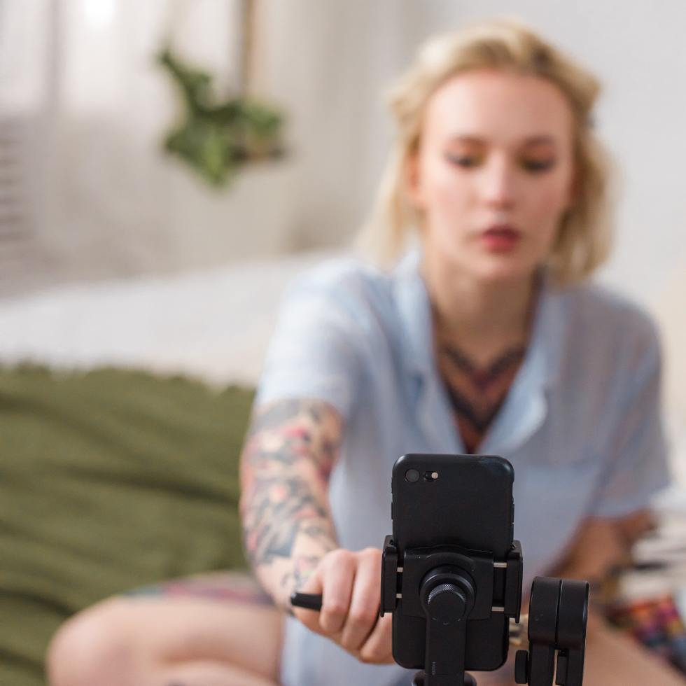 TikTok cybersecurity threat - girl poses in front of camera