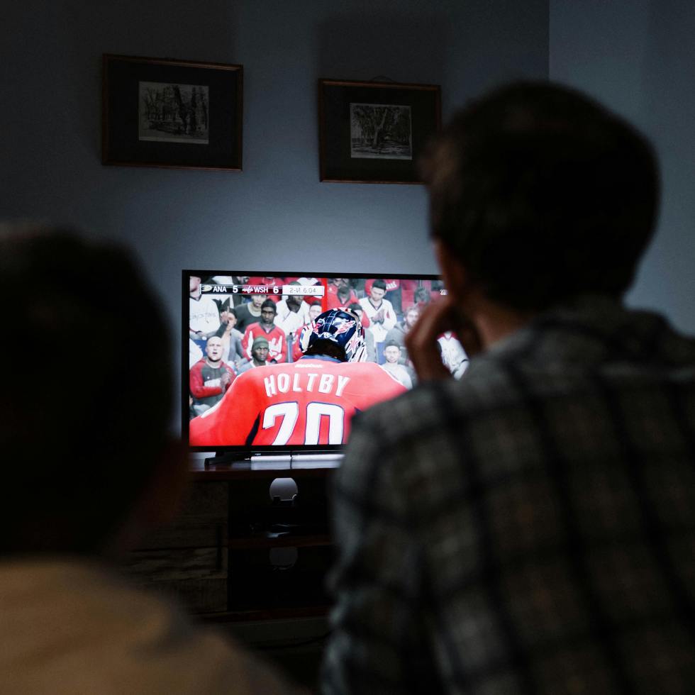 family watches football on TV.